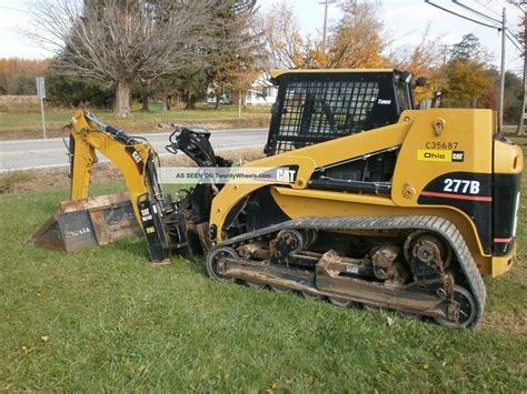 backhoe attachment for caterpillar skid steer|cat skid steer milling attachment.